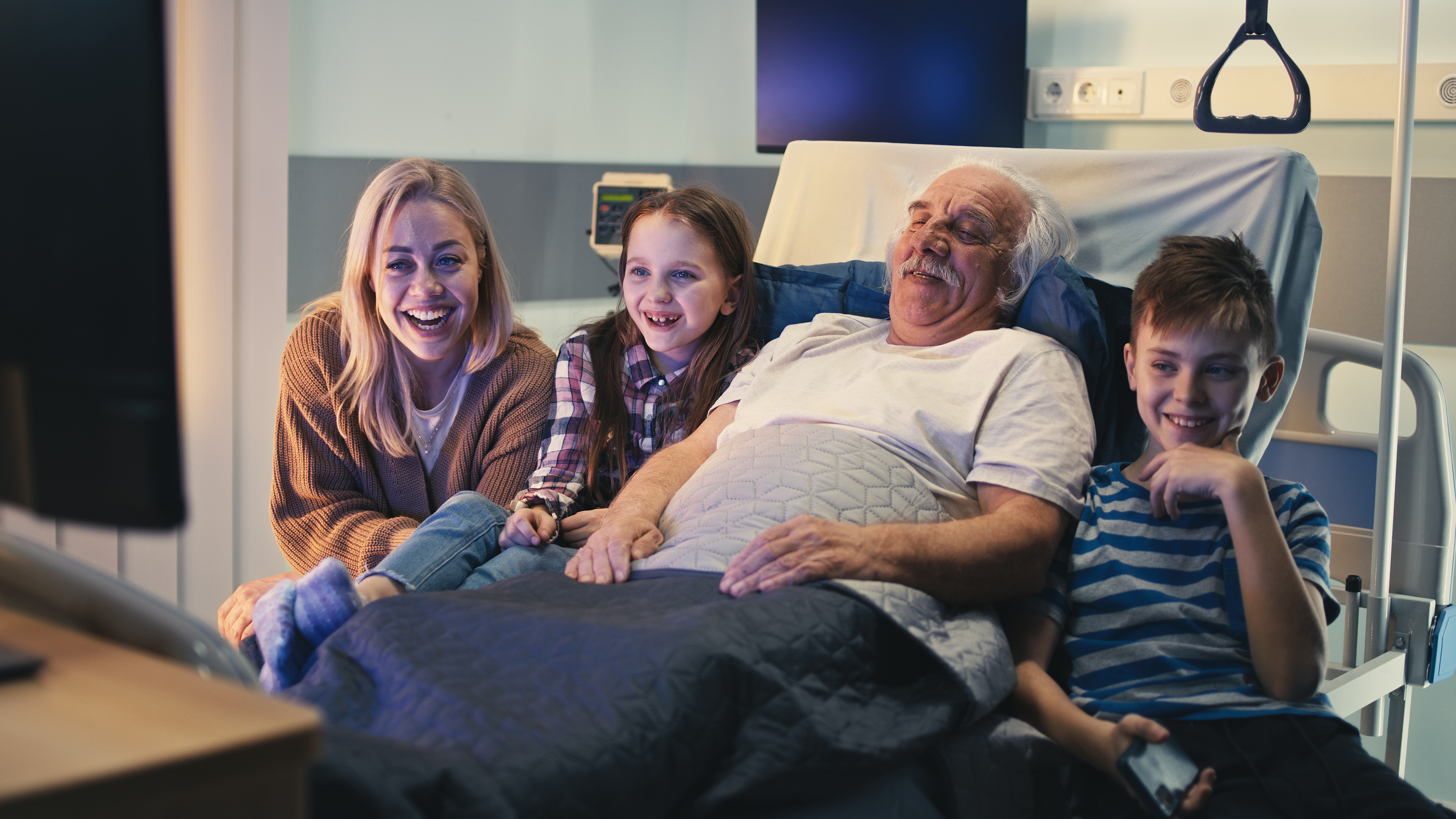 Family watching IPTV in a hospital.