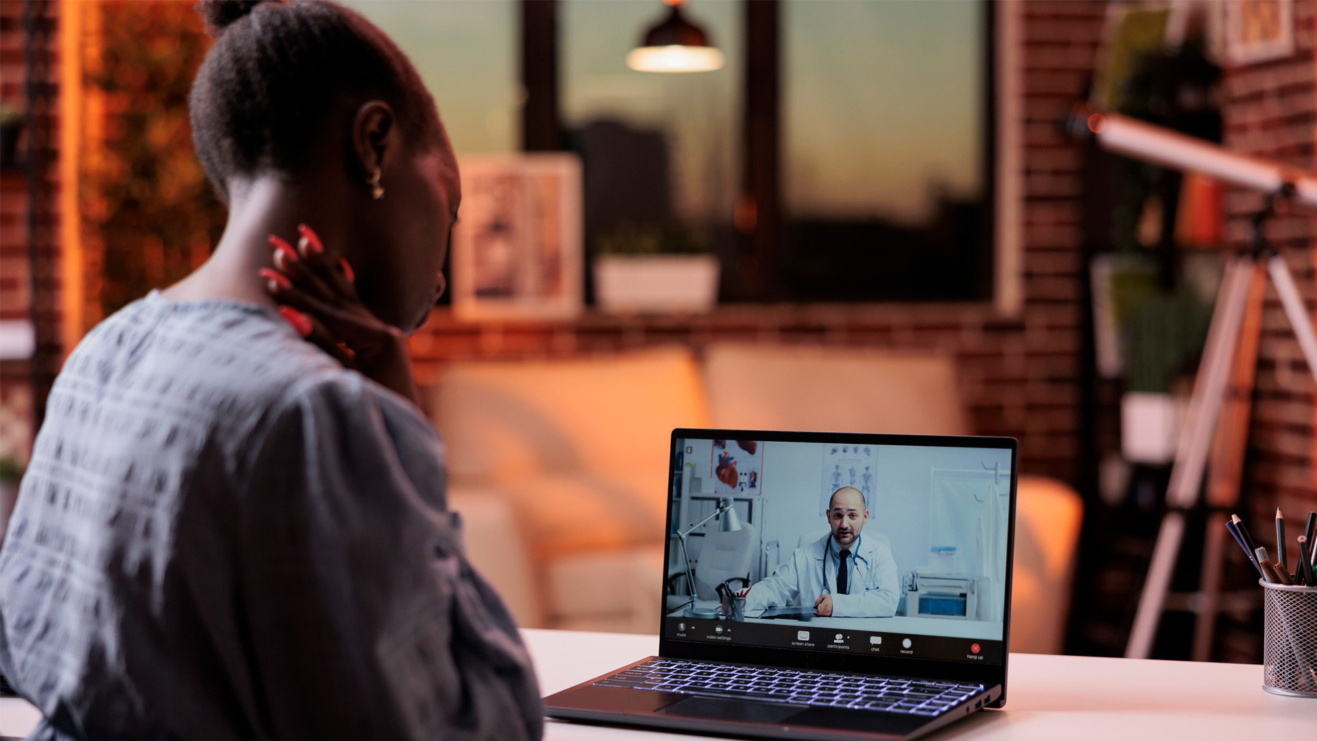 Woman receiving medical care though Telehealth 